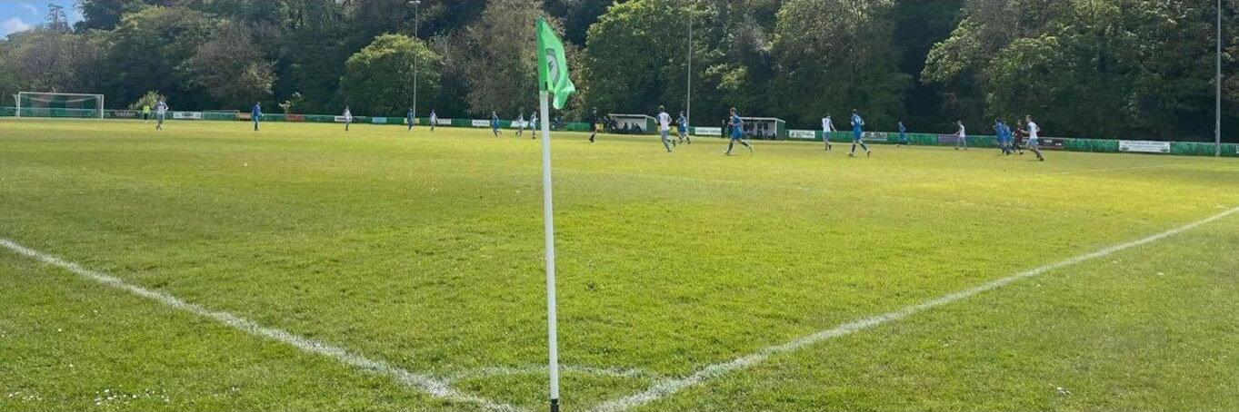A wide view across the pitch at Erme Valley during a senior match
